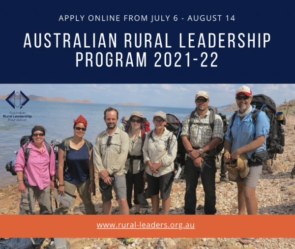 7 people on pebbly shore