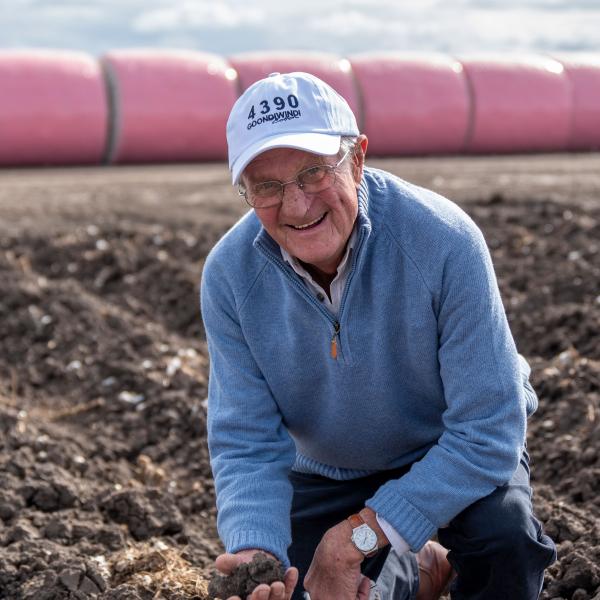 Farmer in ploughed field