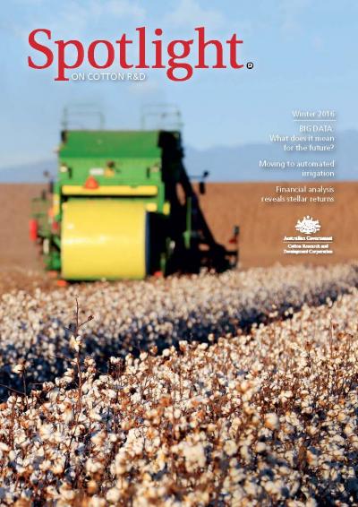Cover of Spotlight Magazine - Winter 2016. A round bale cotton picker picking cotton as it drives away from the camera. Open cotton bolls in front.